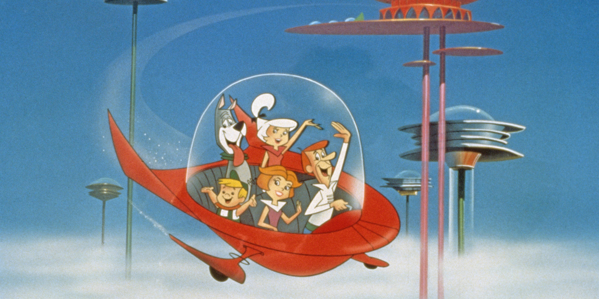 The Jetson family wave as they fly past buildings in space in their spaceship in a still from the animated television series, 'The Jetsons,' circa 1962. (Photo by Warner Bros./Courtesy of Getty Images)