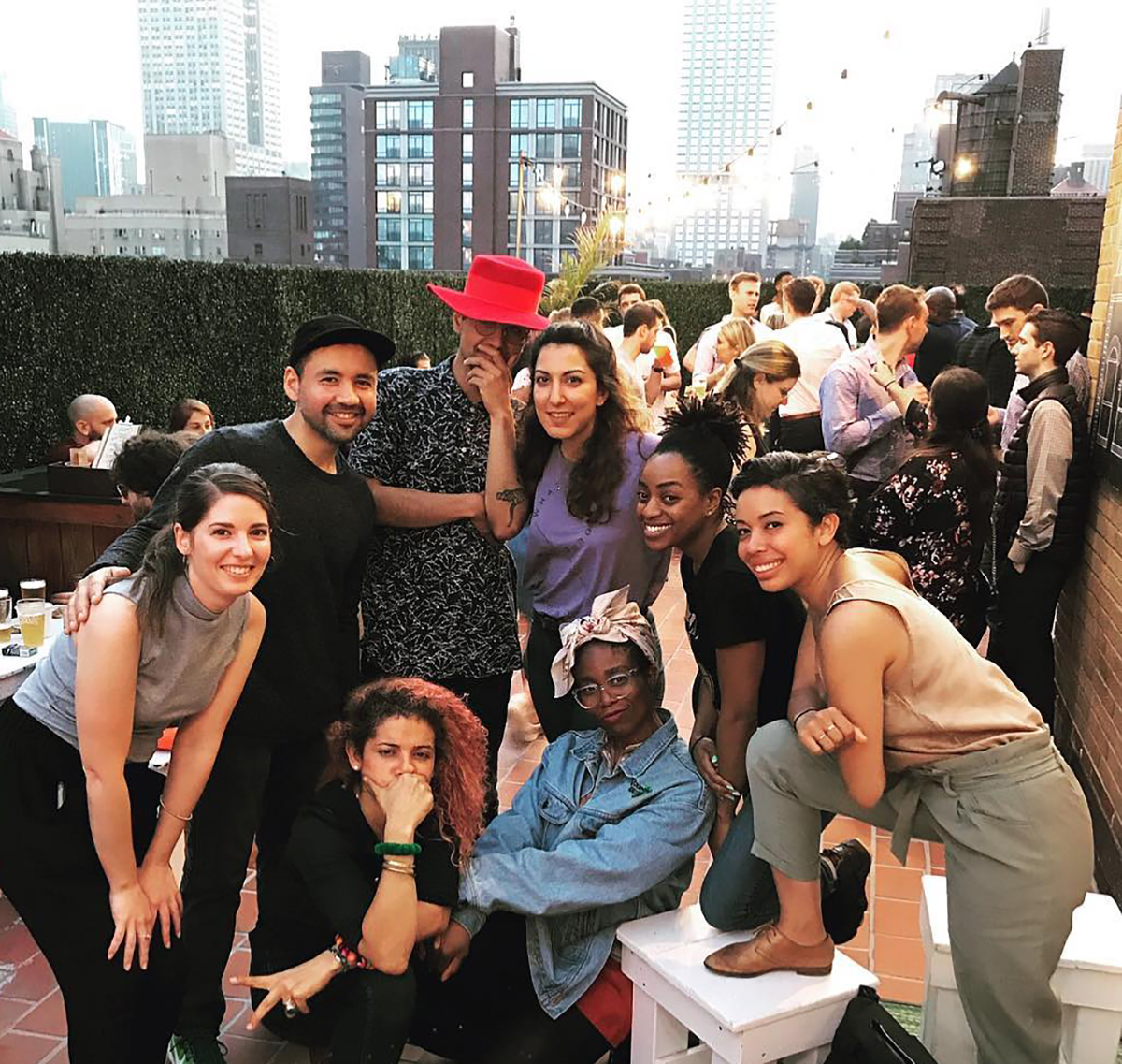 Classmates having drinks at a New York rooftop