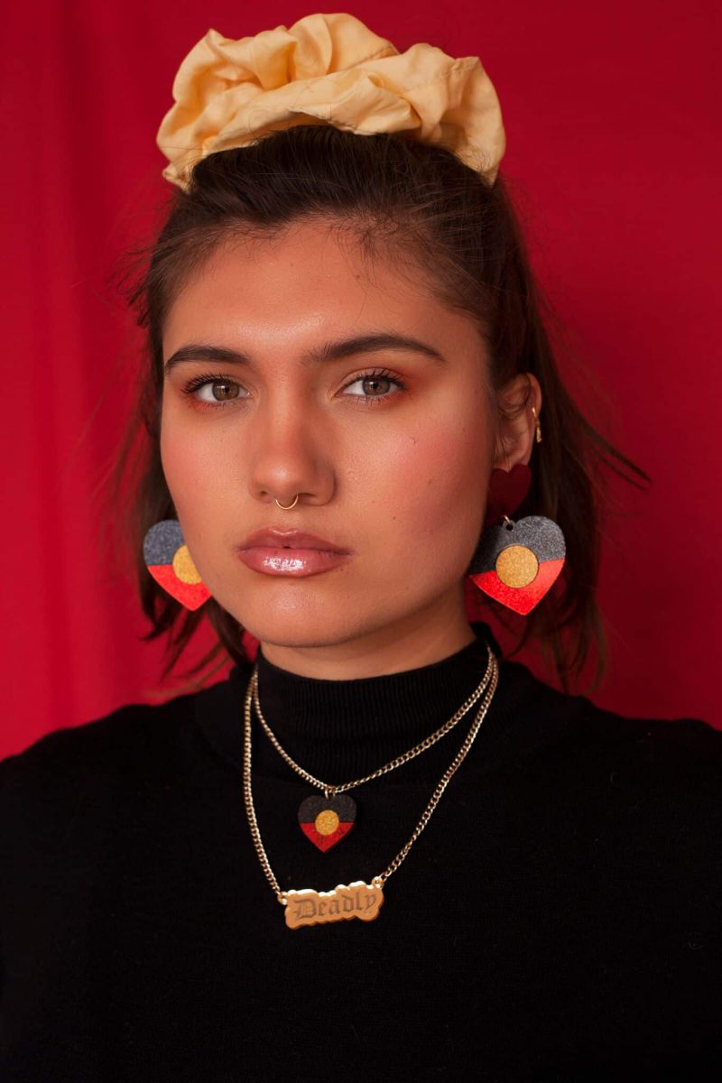Indigenous Pride Glitter earrings and accessories by Haus of Dizzy. 