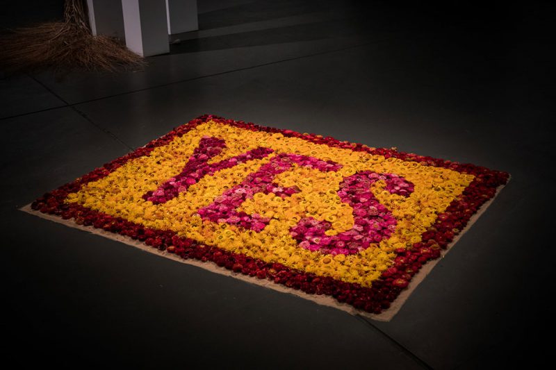 Installation of flowers spelling out the word yes by Aboriginal designer and artist Nicole Monks